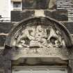 View of relief carved with a judge flanked by lions, on dormer head above top-floor window on S side of Kirkbrae House.
