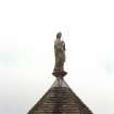 View of statue of St Triduana on top of the roof of St Triduana's 'Wellhouse'.