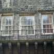View of strapwork above windows on Canongate facade.