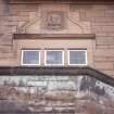 View of carved profile head, in medallion on facade of Scott House, 11 Kinnear Road.