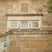 View of carved profile head, in medallion on facade of Jeffrey House, 13 Kinnear Road.