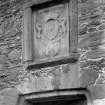 Detail of doorway with coat of arms.