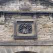 View of coat of arms of the Dick family, in gable above main entrance to stable block.