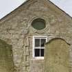 View of blocked doorway in E gable from E.