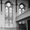 Glasgow, 64 Bothwell Street, Christian Institute, interior.
View of two of the Easternmost stained glass windows  in North-West wall in central hall.