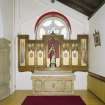 Interior. W side chapel, view of altar from N