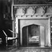 General view of fireplace in vestibule.