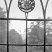 General view of stained glass roundel in window.