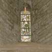 Interior.  Nave, S aisle, 1st bay from W, detail of stained glass window (Adam)