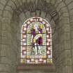 Interior.  Nave, S aisle, 8th  bay from W, detail of stained glass window (John The Baptist)