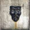 View of bronze mask on the High Street Wellhead.