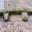 Detail of two corbels on apse