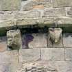 Detail of two corbels on apse