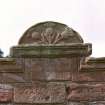 Detail of pediment above niche.