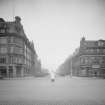 View from south of South Charlotte Street showing 134 and 136 Princes Street, cars and traffic warden.