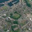 Oblique aerial view of Rothesay centred on the remains of the castle and chapel, taken from the SW.