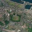 Oblique aerial view of Rothesay centred on the remains of the castle and chapel, taken from the S.
