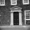 Detail of pedimented main entrance.