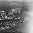 Dundee, general view, showing Carlochie Place and Greendykes Road.   Oblique aerial photograph taken facing north. 