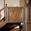 Interior.
Laird's loft, detail of carved wooden panel at top of stair at E end.