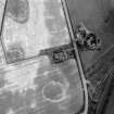 Oblique aerial view showing the cropmark of a possible enclosure, East Fortune.

