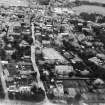 Elgin, general view, showing St Columba's Church of Scotland, Elgin Tennis Club and St Sylvester's Roman Catholic Church. Oblique aerial photograph taken facing north.