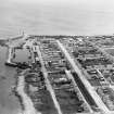 Lossiemouth, general view, showing Commerce Street, Lossiemouth Harbour and Marina Quay.  Oblique aerial photograph taken facing east.