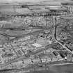 Cowdenbeath, general view, showing Miners' Welfare Institute, Broad Street and Central Park Football Ground.  Oblique aerial photograph taken facing north.