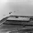 Former Ardrossan Dry Dock and Shipbuilding Co. Inches Yard, Ardrossan.  Oblique aerial photograph taken facing south.