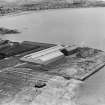 Former Ardrossan Dry Dock and Shipbuilding Co. Inches Yard and South Bay, Ardrossan.  Oblique aerial photograph taken facing east.