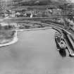 Montgomerie Pier and Ardrossan Refinery, Ardrossan.  Oblique aerial photograph taken facing east.