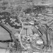 Paisley, general view, showing Ferguslie Fireclay Works and J and P Coats Ltd. Ferguslie Mills Thread Works.  Oblique aerial photograph taken facing east.