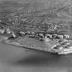 Ardrossan Refinery, Ardrossan Harbour.  Oblique aerial photograph taken facing east.