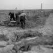 Excavation photograph: Workmen removing blown sand covering house 2.
Copy negative 1995. Original print in Print Room.