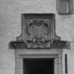 Detail of Hay and Nicolson armorial panel dated 1676 above doorway in S range's courtyard elevation.