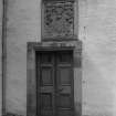 Detail of doorway with surmounting Hay and Durham armorial panel dated 1660 in E range's courtyard elevation.