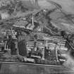 Tullis Russell and Co. Paper Mill, Glenrothes.  Oblique aerial photograph taken facing north. Power Station at top, Rothes Bleachfield on left and Rothes Mill on right.