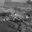 Tullis Russell and Co. Paper Mill, Glenrothes.  Oblique aerial photograph taken facing north. The site before the building of Auchmuty machine houses Nos 4 (1957) and 5 (1970s) and the Finishing Building which swept away some of the 19th century Auchmuty Mill area.