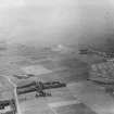 Oblique aerial photograph taken facing west showing Port Seton Aerodrome and the Port Seton golf course in 1935.