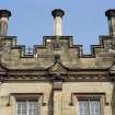 Detail of chimney, shield and carved pediment on south front