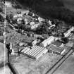 Ballantyne's Cashmere Caerlee Mills, Damside, Innerleithen.  Oblique aerial photograph taken facing north-east.  This image has been produced from a crop marked negative.