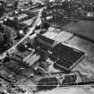 Ballantyne's Cashmere Caerlee Mills, Damside, Innerleithen.  Oblique aerial photograph taken facing south-east.  This image has been produced from a crop marked negative.