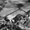 Ballantyne's Cashmere Caerlee Mills, Damside, Innerleithen.  Oblique aerial photograph taken facing south-west.
