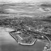 Ardrossan, general view, showing Shell Refining Co. Ltd. Ardrossan Refinery and Glasgow Street.  Oblique aerial photograph taken facing east.