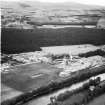 A and G Paterson Ltd. Silverbank Saw Mills, Banchory.  Oblique aerial photograph taken facing north.  This image has been produced from a crop marked negative.