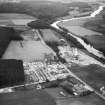 A and G Paterson Ltd. Silverbank Saw Mills, Banchory.  Oblique aerial photograph taken facing east.  This image has been produced from a crop marked negative.