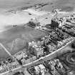 St Andrews, general view, showing Rusack's Hotel, Pilmour Links and Royal and Ancient Golf Club, Golf Place.  Oblique aerial photograph taken facing east.  This image has been produced from a crop marked negative.