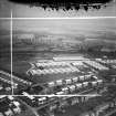 Motherwell, general view, showing Newton Victor Ltd. Works, Watling Street and Fort Street.  Oblique aerial photograph taken facing north-east.  This image has been produced from a damaged and crop marked negative.
