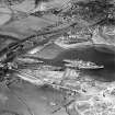 Thomas Ward and Sons Shipbreaking Yard and Caldwells Paper Mill, Inverkeithing.  Oblique aerial photograph taken facing north.