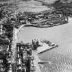 Oban, general view, showing North Pier and Railway Quay.  Oblique aerial photograph taken facing south.